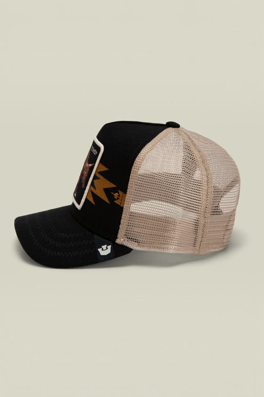 Broderick's Clothing Co. Goorin Bros. Canyon Rowdy trucker hat with black front, tan mesh back, and bull graphic patch.