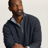 Broderick's Clothing Co. charcoal heather reversible half-zip sweater worn by a man over a light blue collared shirt.