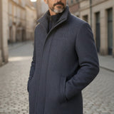Broderick's Clothing Co. charcoal wool blend car coat worn by a man on a cobblestone street