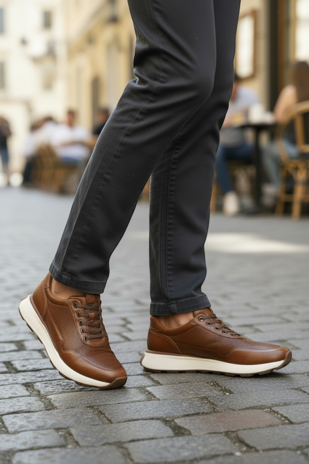 Broderick's Clothing Co. Johnston & Murphy cognac leather joggers with micro-perforations and white cushioned soles.