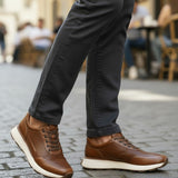 Broderick's Clothing Co. Johnston & Murphy cognac leather joggers with micro-perforations and white cushioned soles.