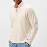 Broderick's Clothing Co. cream textured knit pullover with a hidden snap placket worn by a man.