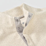 Broderick's Clothing Co. cream textured knit pullover featuring a hidden snap placket and soft cotton-modal blend.