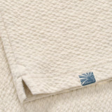 Broderick's Clothing Co. Johnnie-O cream textured cotton-modal knit pullover fabric detail with logo tag