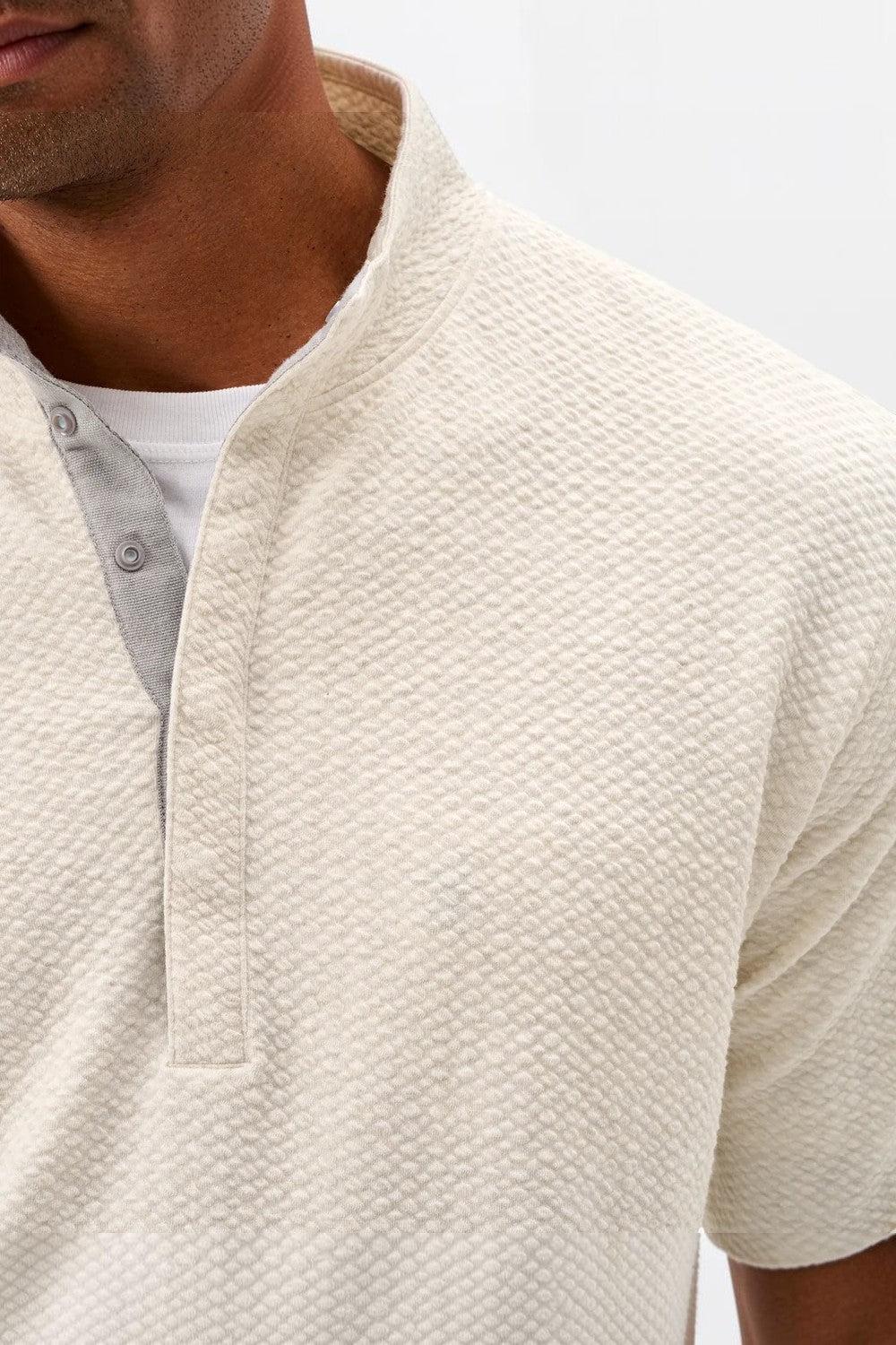 Broderick's Clothing Co. cream textured knit pullover with a hidden snap placket and soft cotton-modal blend fabric.