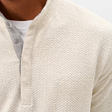 Broderick's Clothing Co. cream textured knit pullover with a hidden snap placket and soft cotton-modal blend fabric.