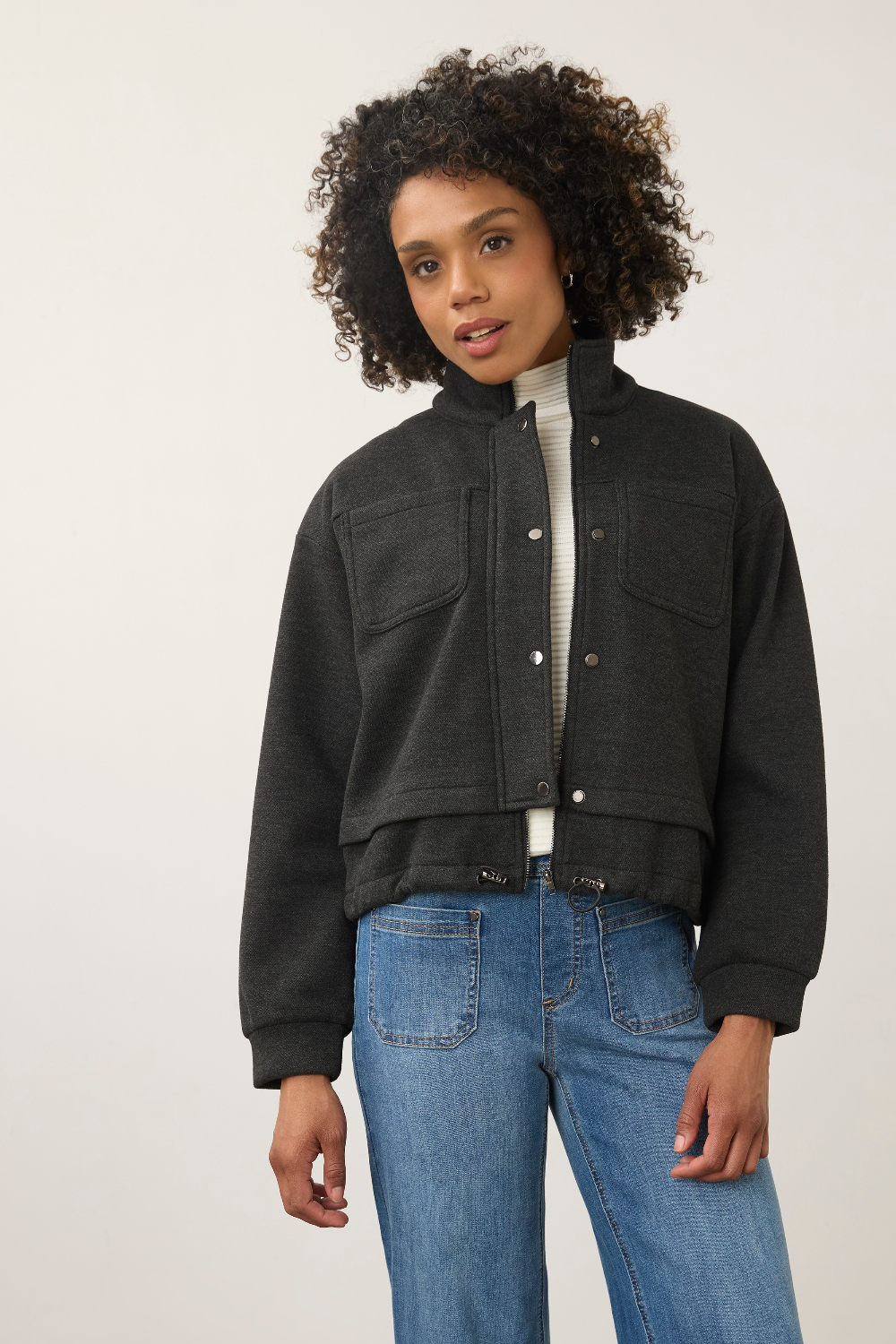 Broderick's Clothing Co. dark gray cropped bomber jacket in bonded knit fabric with snap buttons and chest pockets.