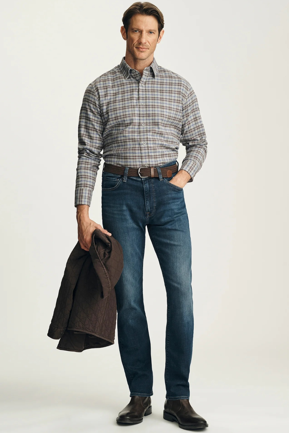 Broderick's Clothing Co. 34 Heritage dark vintage straight leg jeans with golden stitching worn by a male model