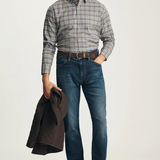 Broderick's Clothing Co. 34 Heritage dark vintage straight leg jeans with golden stitching worn by a male model