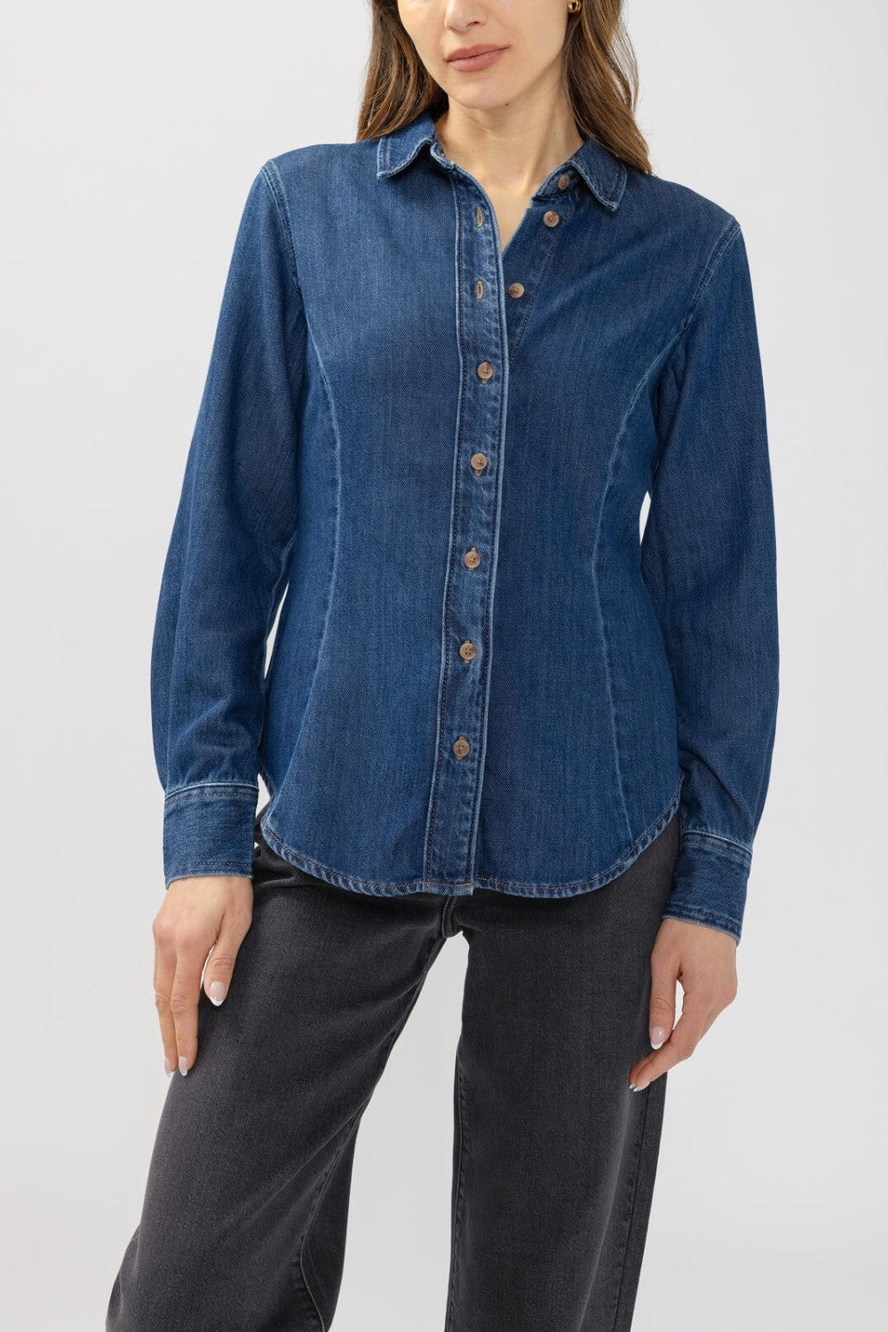 Broderick's Clothing Co. medium-wash blue denim shirt with princess seams and button-down front on a model