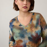 Broderick's Clothing Co. FDJ drop shoulder 3/4 sleeve top in a multi-colored fall-toned abstract print.