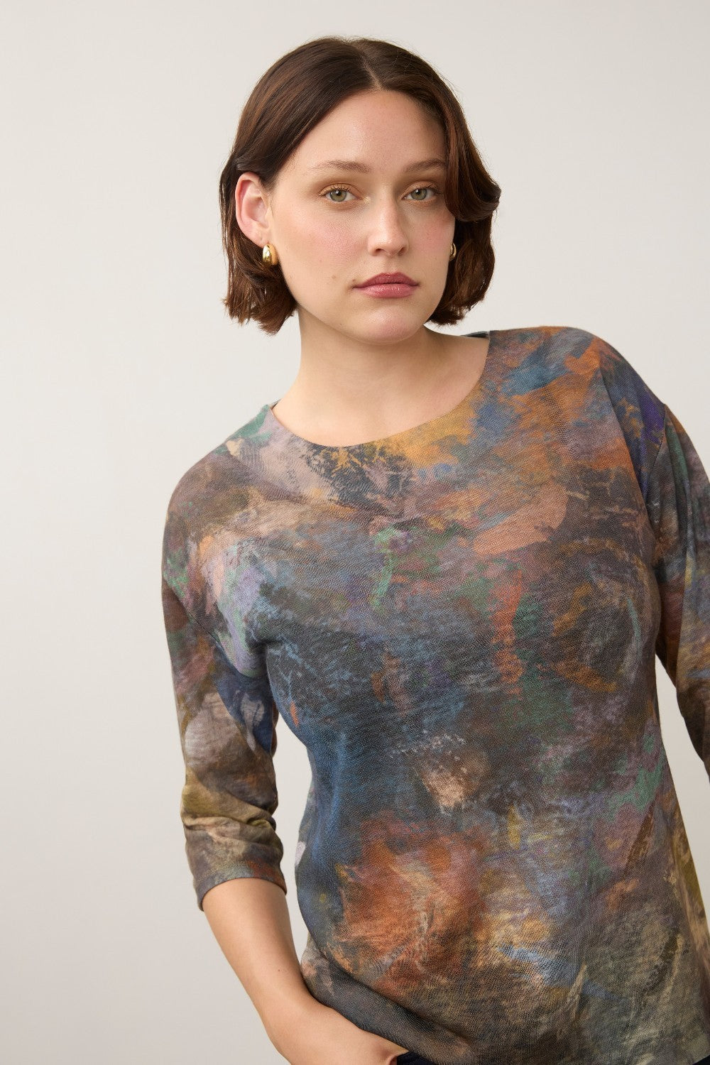 Broderick's Clothing Co. FDJ 3/4 sleeve top featuring a multi-colored abstract print on lightweight fabric