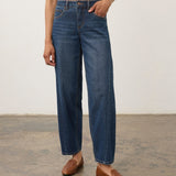Model wearing Broderick's Clothing Co. FDJ Girlfriend Barrel Ankle denim jeans with a relaxed, tapered fit.