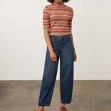 Model wearing Broderick's Clothing Co. FDJ Girlfriend Barrel Ankle dark wash denim jeans with a relaxed fit.