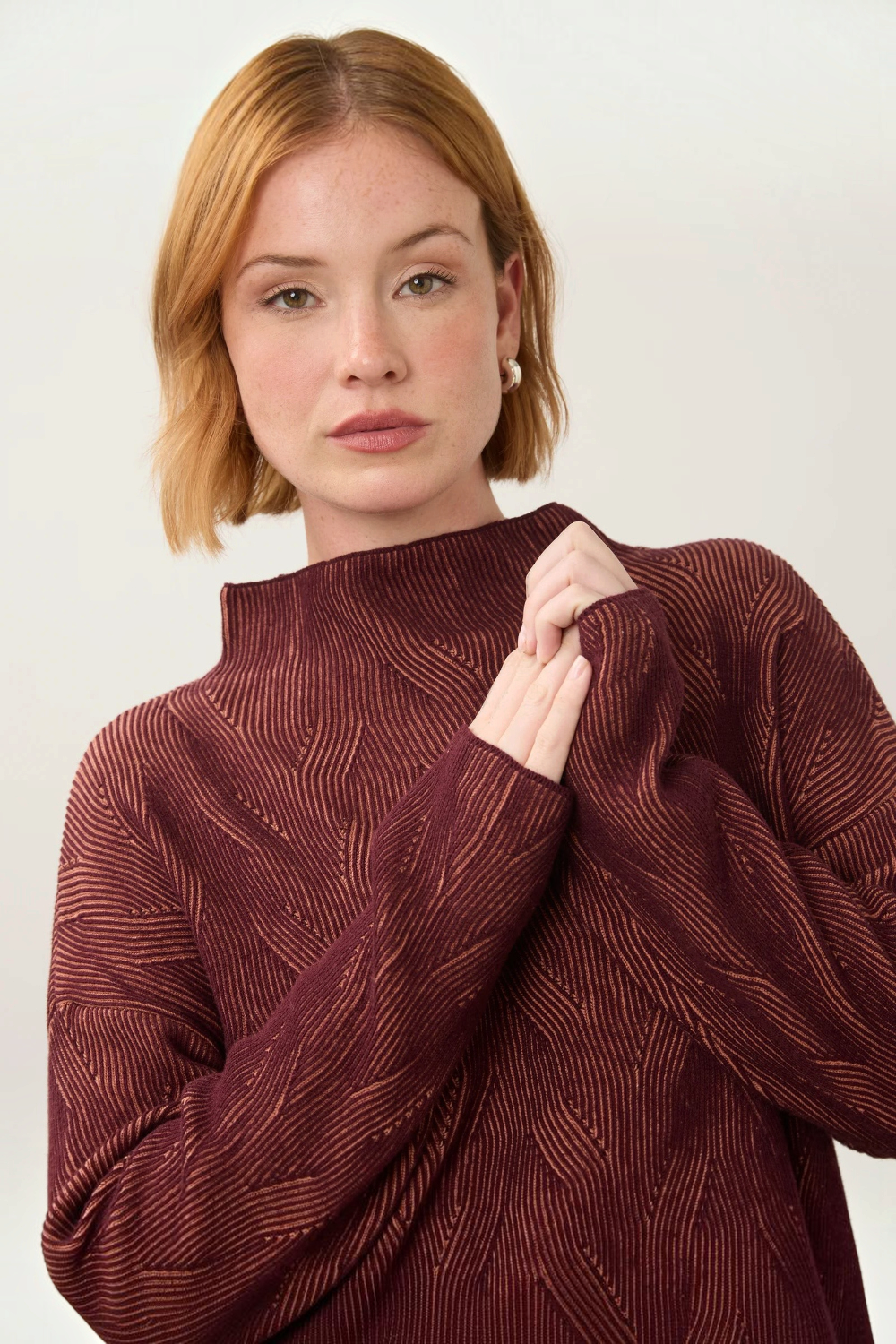 Broderick's Clothing Co. FDJ long sleeve funnel neck sweater in fig and blush textured cotton knit on a model