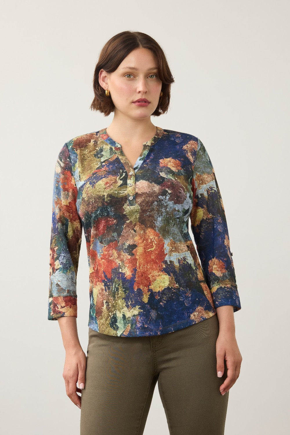 Model wearing a Broderick's Clothing Co. FDJ 3/4 sleeve henley top featuring a vibrant multi-colour abstract print.