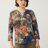 Model wearing a Broderick's Clothing Co. FDJ 3/4 sleeve henley top featuring a vibrant multi-colour abstract print.