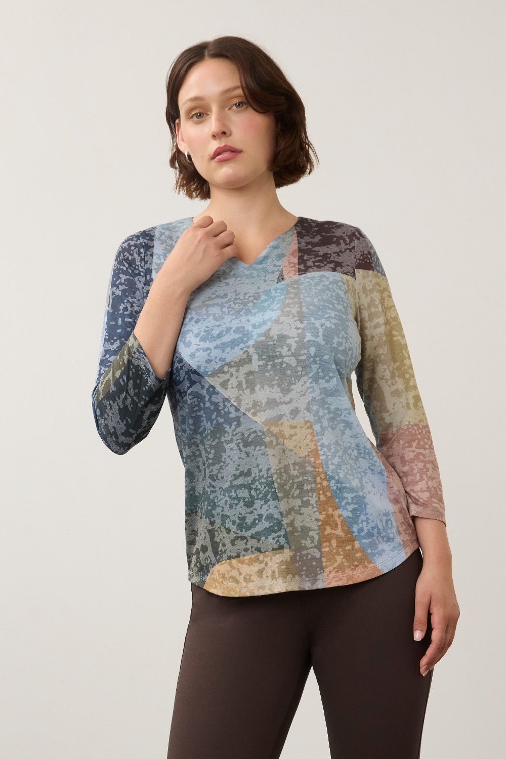 Broderick's Clothing Co. FDJ 3/4 sleeve notch neck top in a multi-colour geometric print on a model