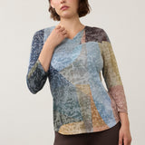 Broderick's Clothing Co. FDJ 3/4 sleeve notch neck top in a multi-colour geometric print on a model