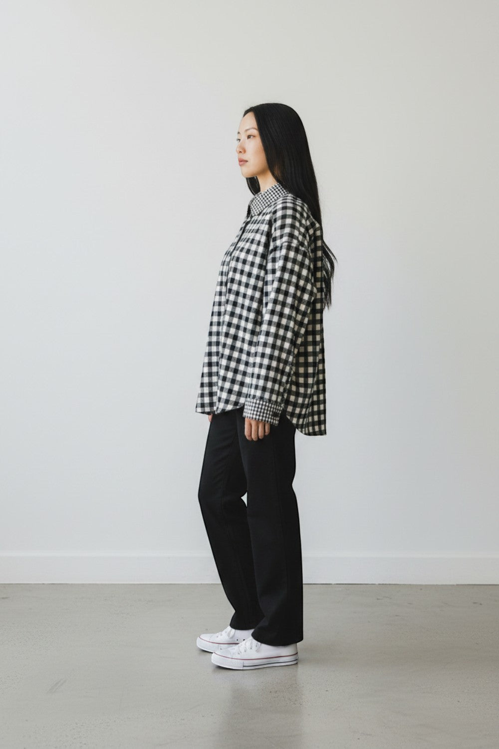 Broderick's Clothing Co. Shannon Passero Aubrey black and white gingham button-down shirt on a model in profile view.