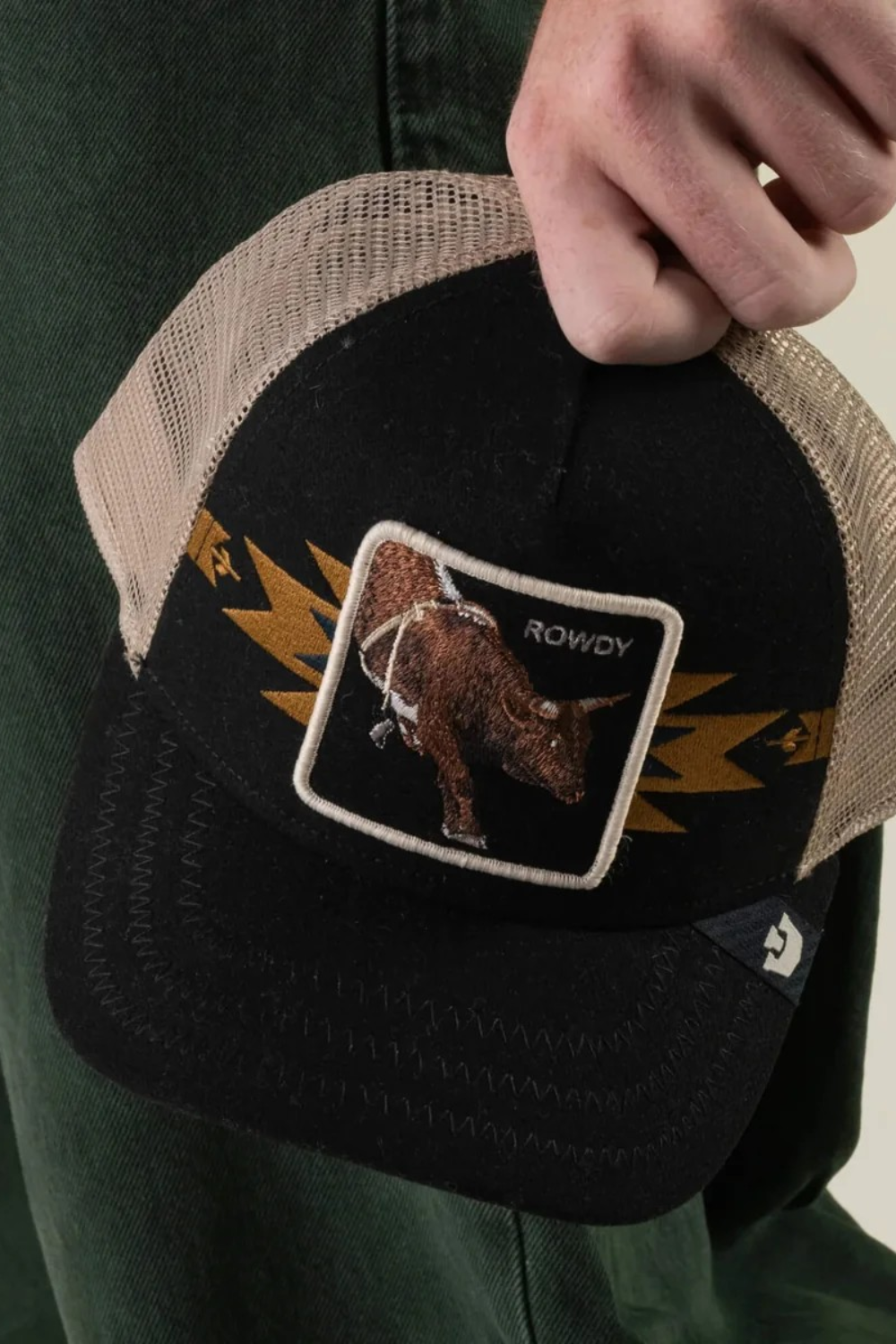 Broderick's Clothing Co. Goorin Bros. black and tan trucker hat featuring a bull patch and yellow lightning bolt detail