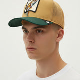 Broderick's Clothing Co. Goorin Bros. tan and green trucker hat with a fish patch worn by a man