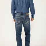 Broderick's Clothing Co. Silver Jeans Co. Grayson straight leg jeans in medium wash denim, back view on a man.