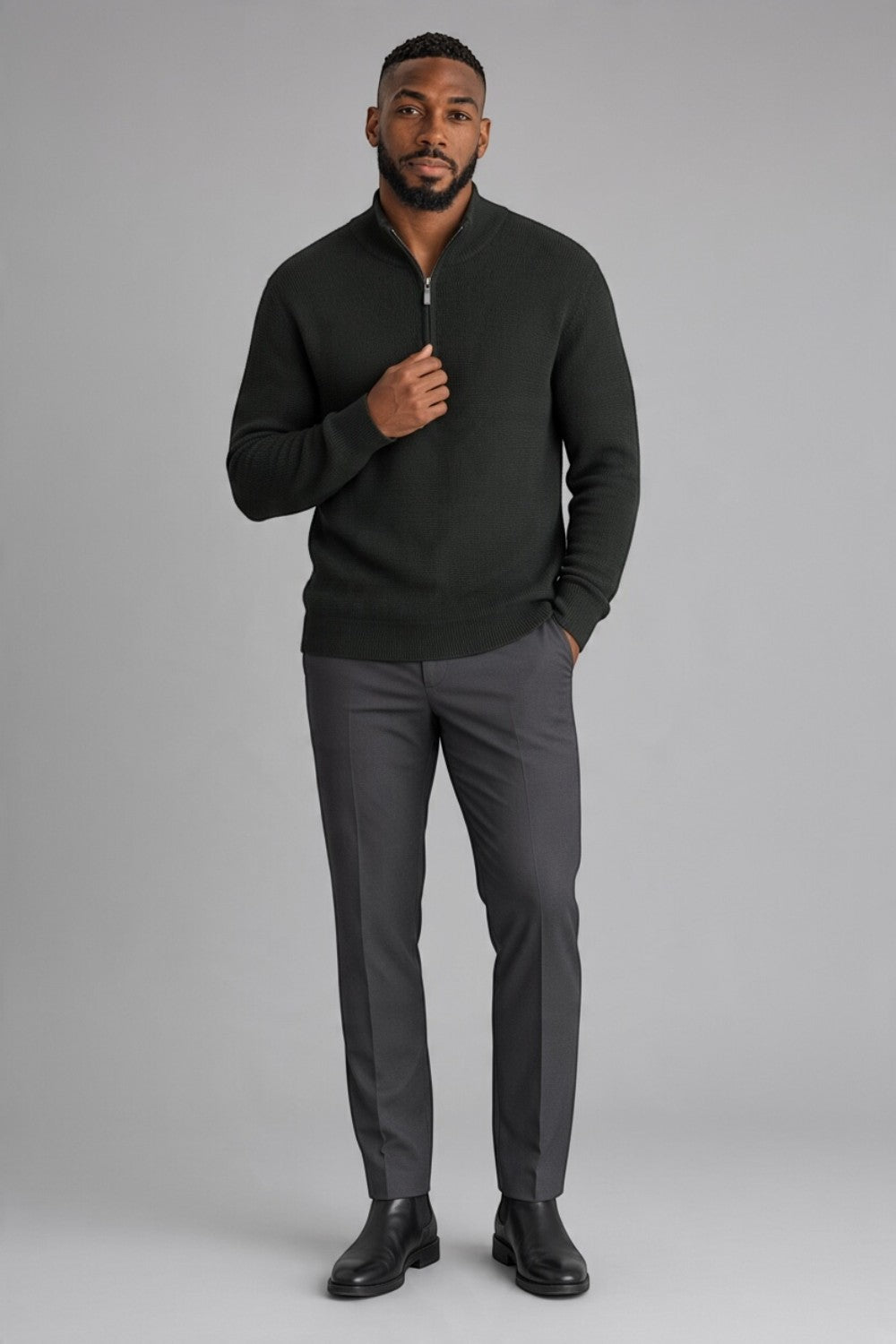 Broderick's Clothing Co. dark green textured cotton quarter-zip sweater worn by a man with grey trousers