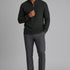 Broderick's Clothing Co. dark green textured cotton quarter-zip sweater worn by a man with grey trousers