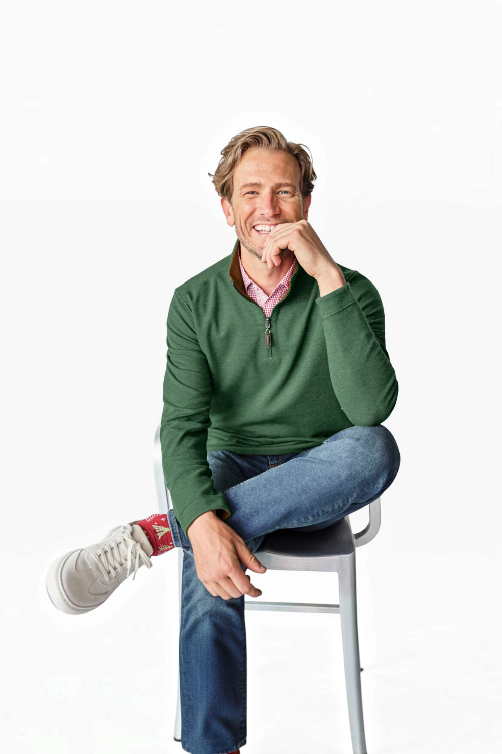 Broderick's Clothing Co. green reversible quarter-zip sweater worn by a smiling man with jeans and white sneakers.