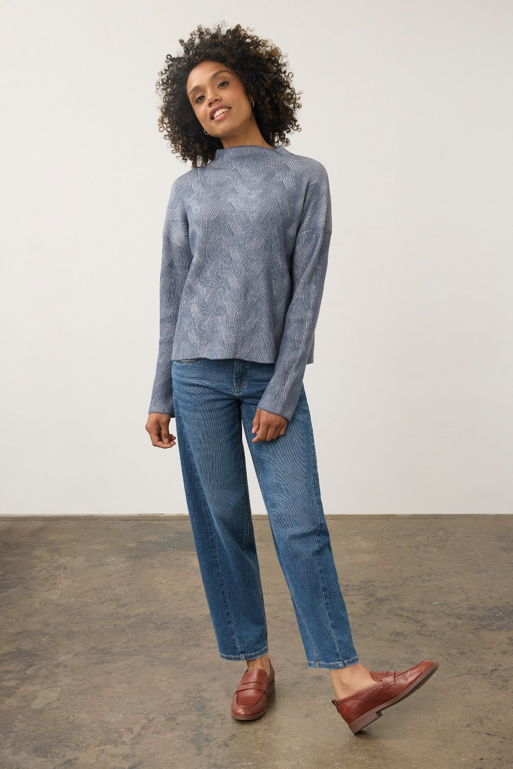 Model wearing a Broderick's Clothing Co. FDJ long sleeve funnel neck sweater in light grey with a textured pattern.
