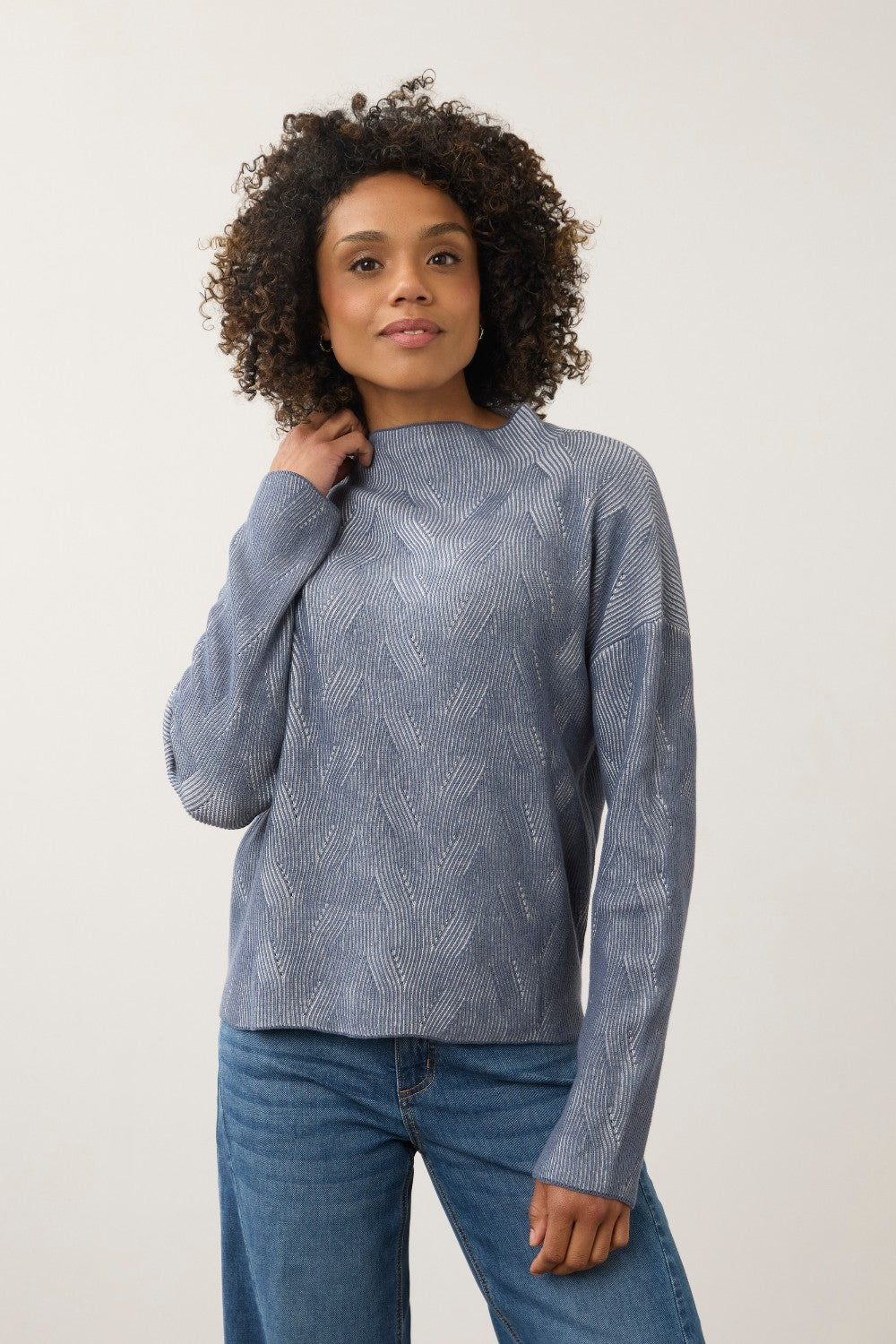 Broderick's Clothing Co. light grey heather long sleeve funnel neck sweater with textured chevron pattern on a model.