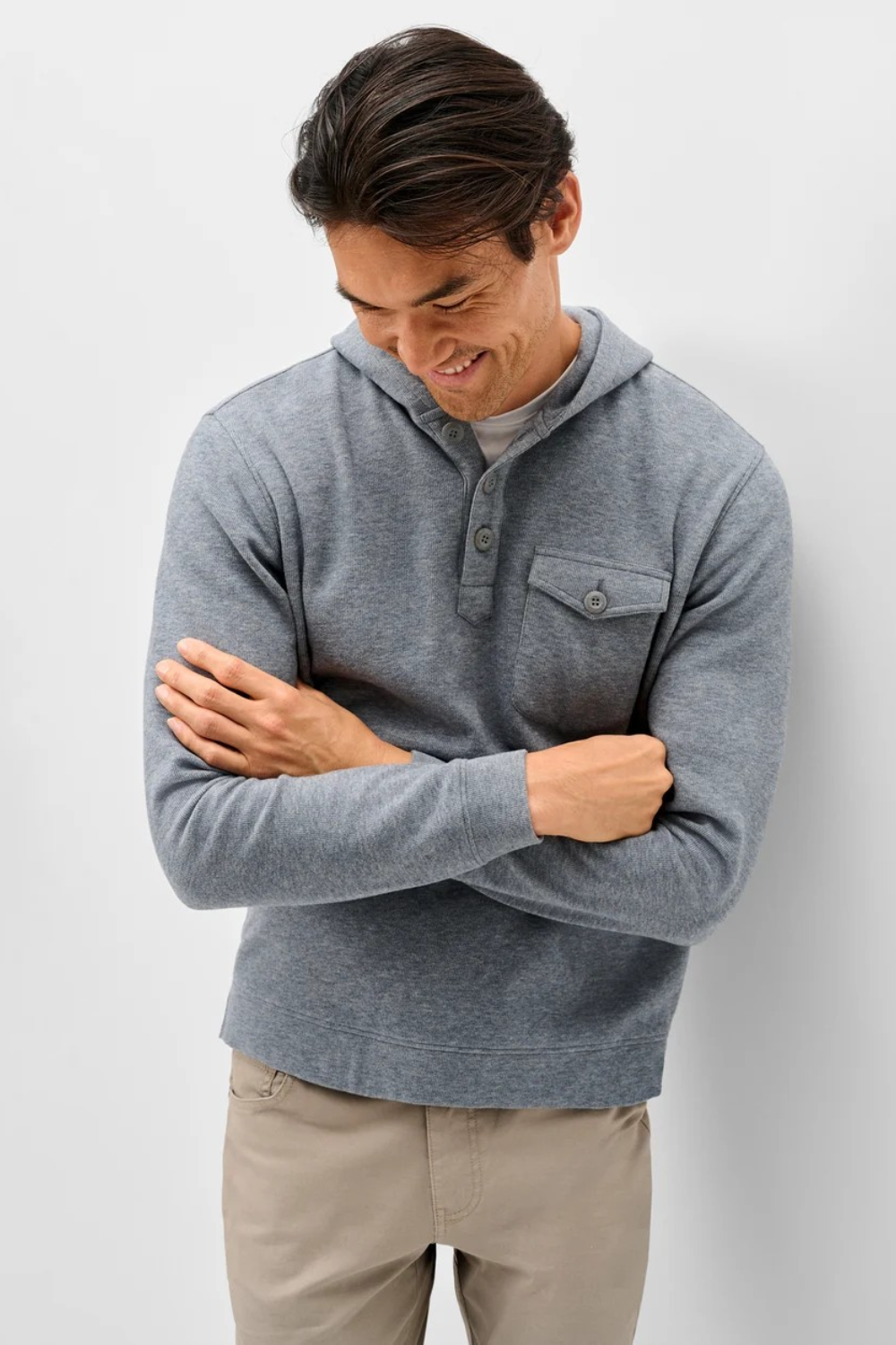 Broderick's Clothing Co. grey heathered button henley hoodie with a chest pocket worn by a smiling man