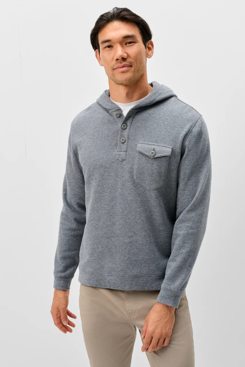 Broderick's Clothing Co. grey heathered button henley hoodie with a chest pocket worn by a man against a white background