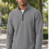 Broderick's Clothing Co. grey melange quarter-zip sweater worn by a man in an outdoor setting