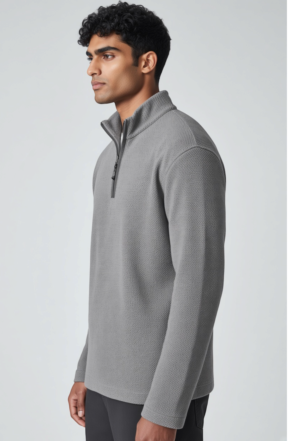Broderick's Clothing Co. grey melange quarter-zip sweater worn by a man in a side profile view