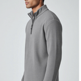 Broderick's Clothing Co. grey melange quarter-zip sweater worn by a man in a side profile view