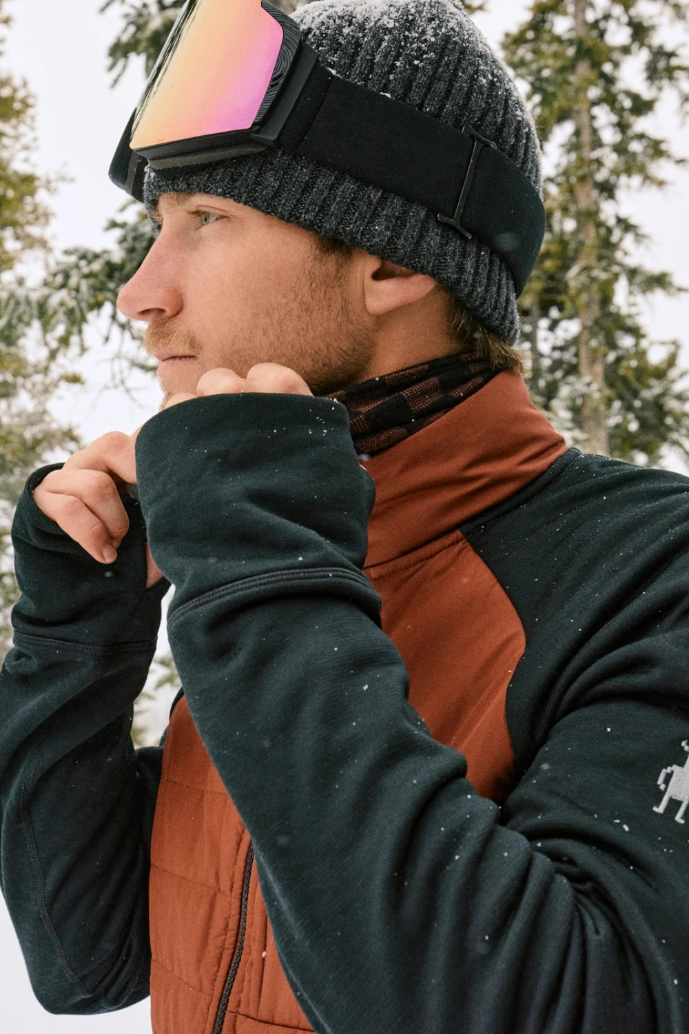 Broderick's Clothing Co. man wearing a grey ribbed Smartwool Second Cut cuffed beanie with ski goggles in the snow