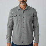 Broderick's Clothing Co. grey twill overshirt with dual chest pockets worn by a man against a light background