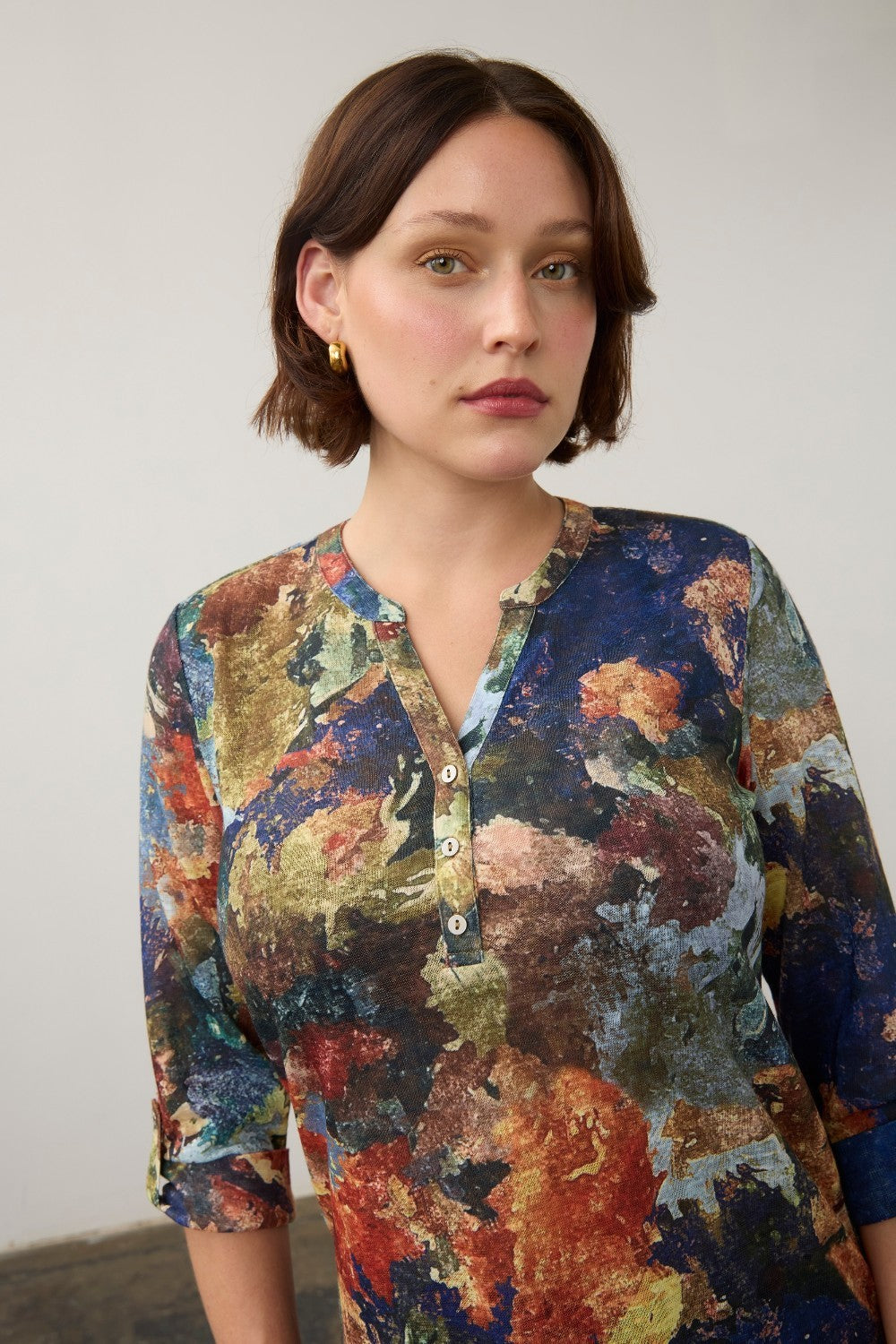Broderick's Clothing Co. FDJ 3/4 sleeve henley top featuring a vibrant multi-colour abstract print on a woman