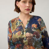 Broderick's Clothing Co. FDJ 3/4 sleeve henley top featuring a vibrant multi-colour abstract print on a woman