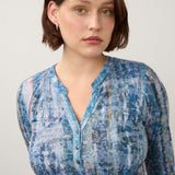 Broderick's Clothing Co. FDJ indigo henley top with three-quarter sleeves and a textured abstract print