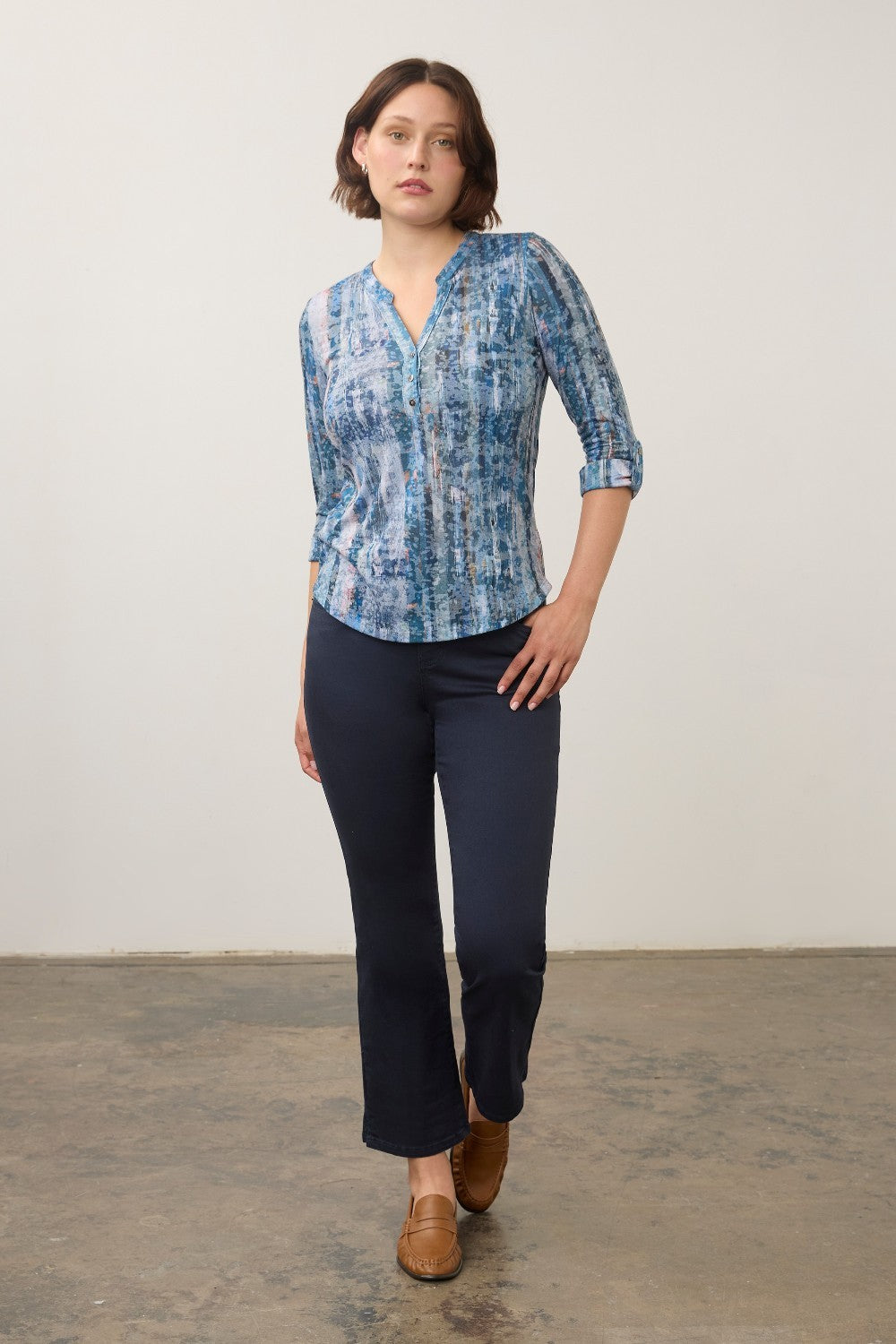 Model wearing a Broderick's Clothing Co. FDJ indigo patterned 3/4 sleeve henley top with dark blue trousers