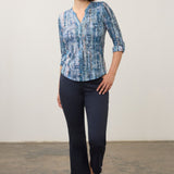 Model wearing a Broderick's Clothing Co. FDJ indigo patterned 3/4 sleeve henley top with dark blue trousers