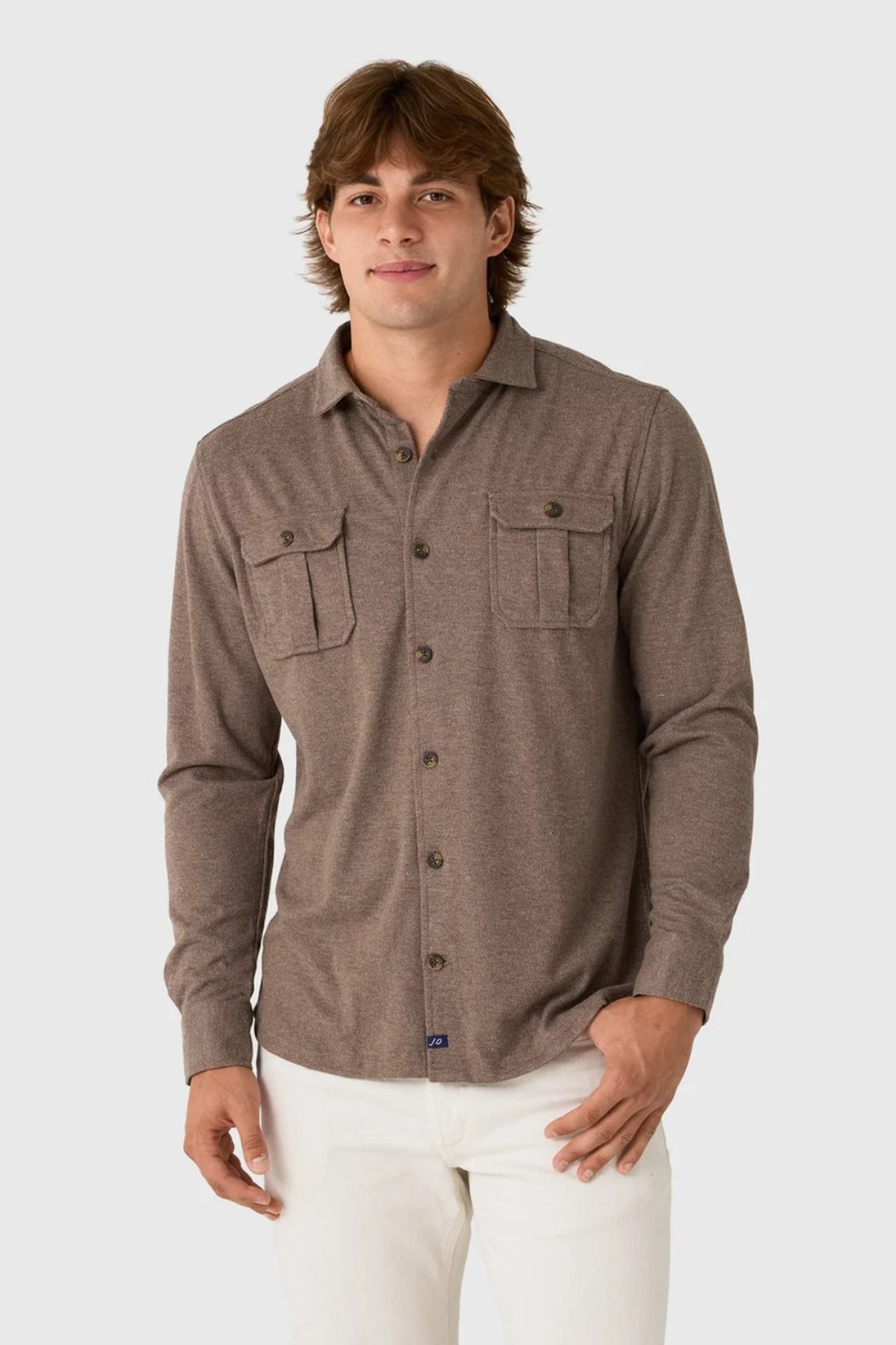 Broderick's Clothing Co. Johnnie-O brown twill overshirt with dual chest pockets worn by a man on a grey background