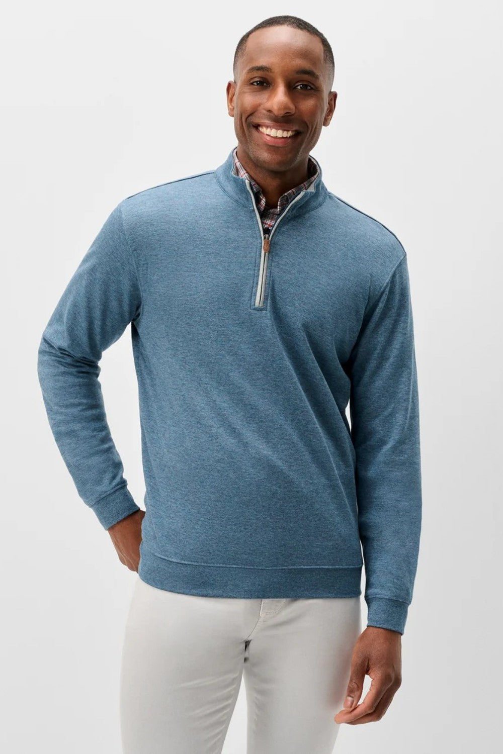 Broderick's Clothing Co. Johnnie-O Sully blue cotton-blend quarter-zip pullover worn by a smiling man