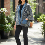 Model wearing a Broderick's Clothing Co. Shannon Passero Karol Cardigan with patterned fabric and denim trim details.