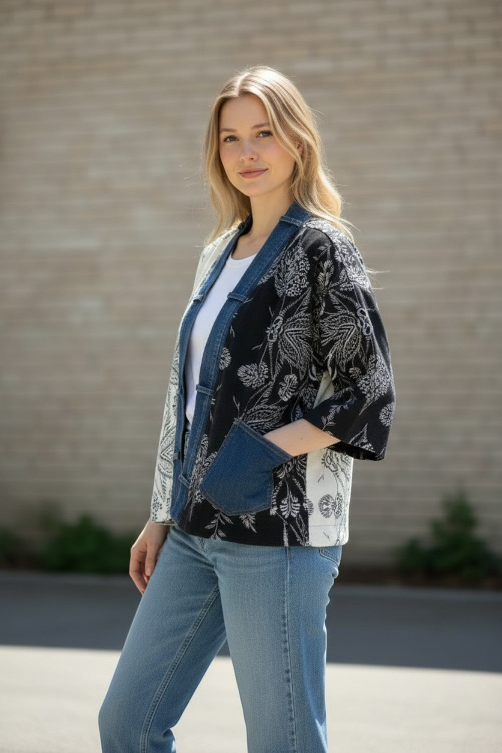 Broderick's Clothing Co. Shannon Passero Karol Cardigan with cream and black floral panels and denim trim details.