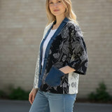 Broderick's Clothing Co. Shannon Passero Karol Cardigan with cream and black floral panels and denim trim details.