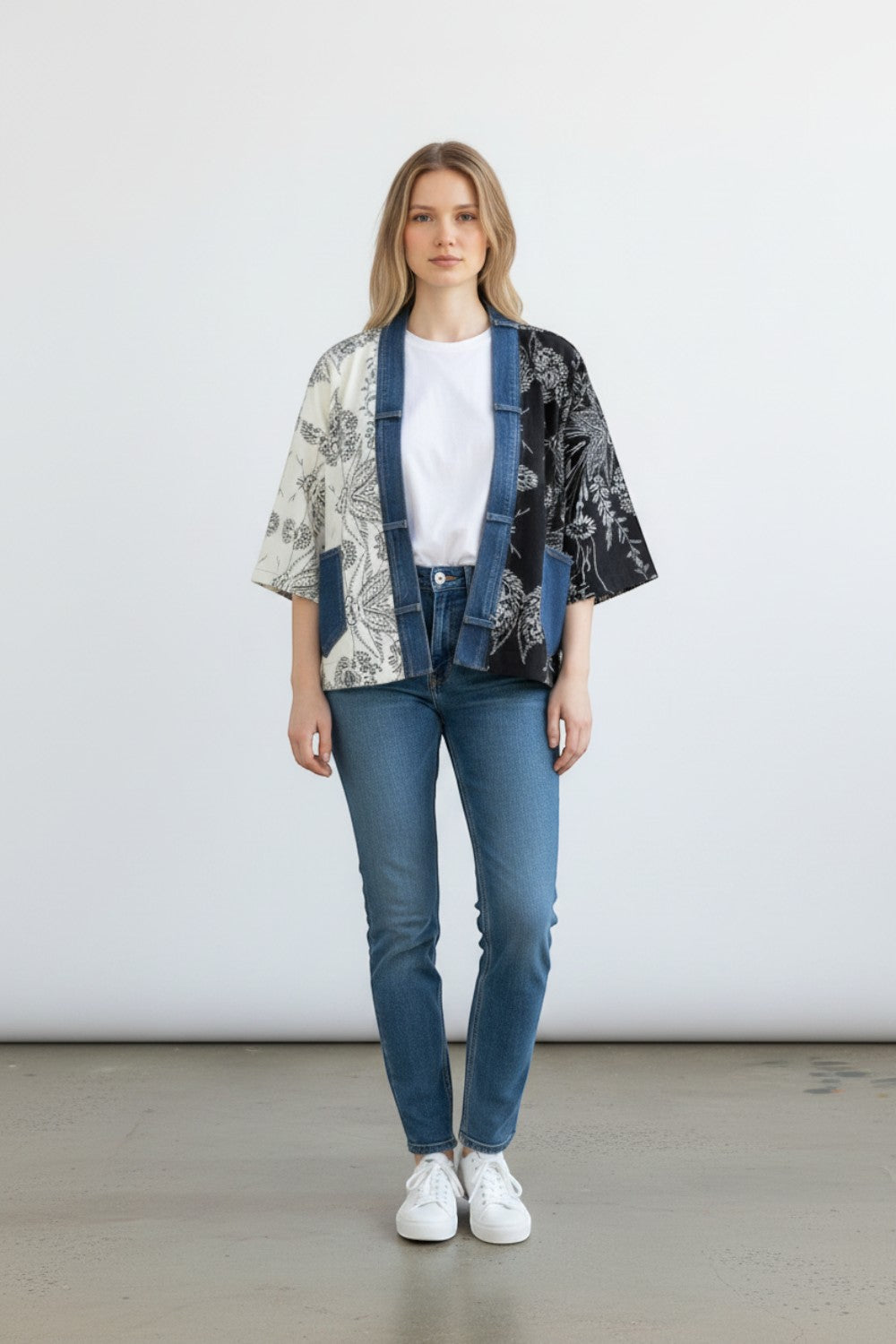 Broderick's Clothing Co. Karol Cardigan with split-panel black and cream floral print and denim trim details.